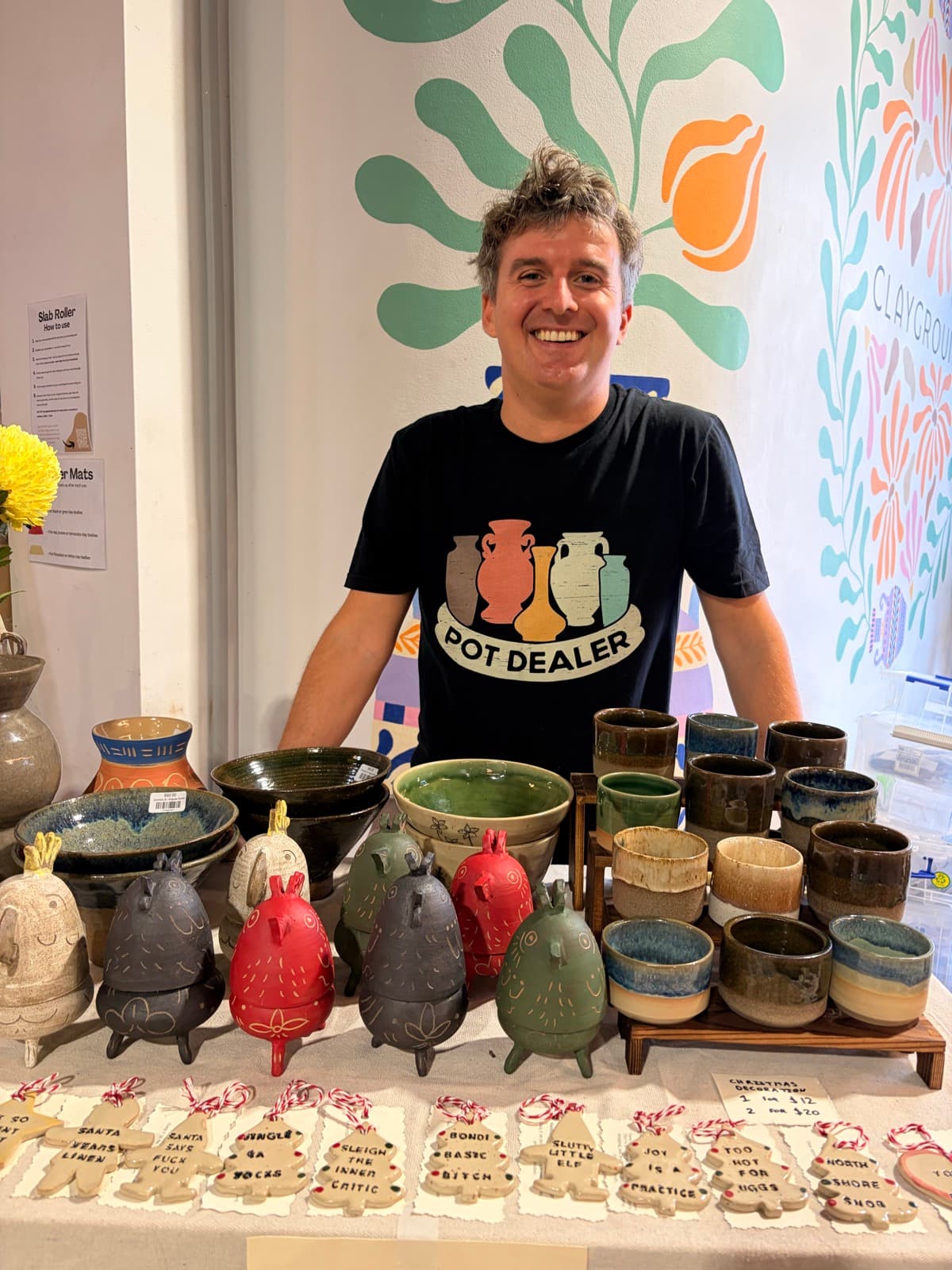 Dom Boland in front of his Palm and Potter ceramics work at a market